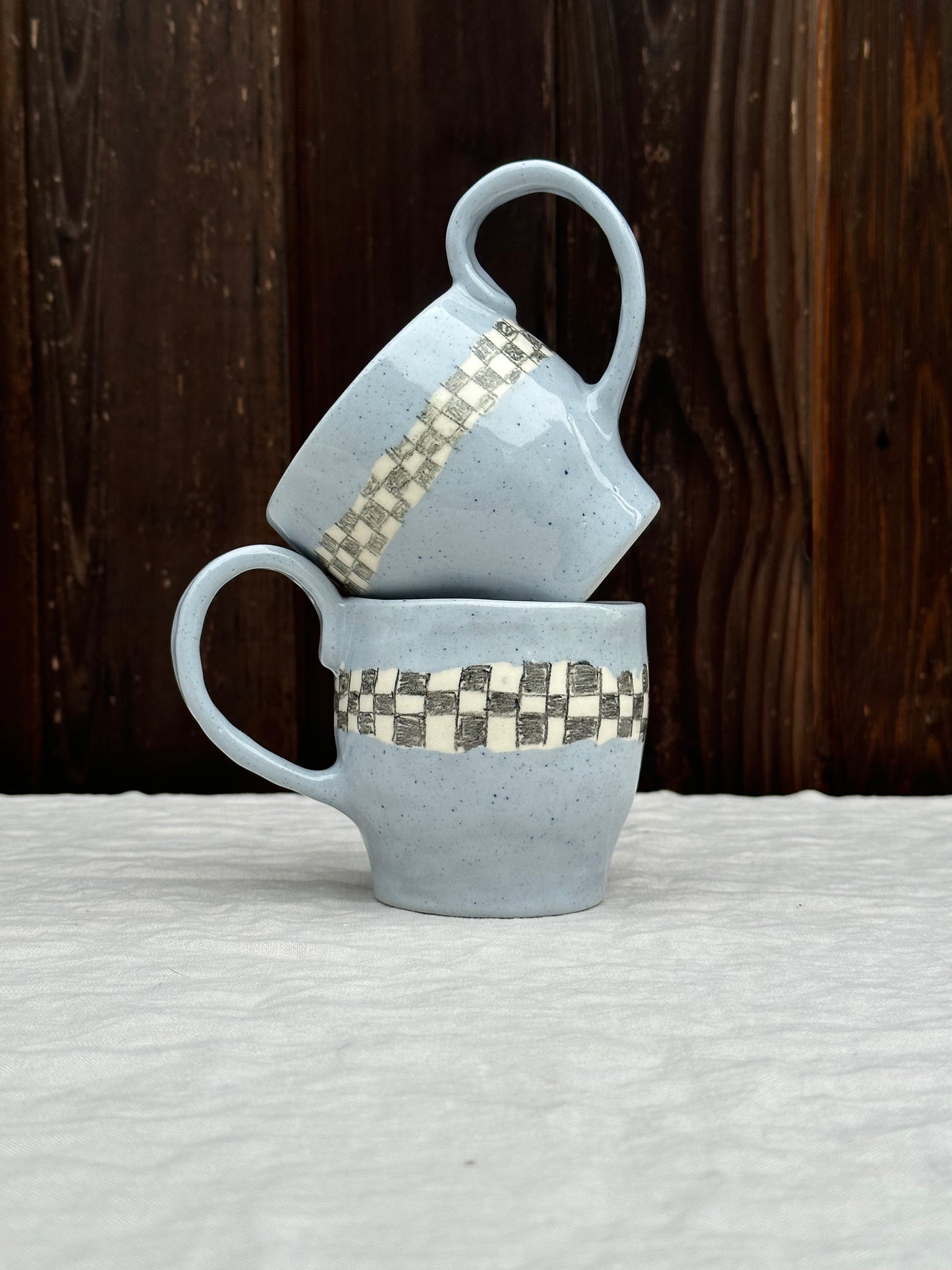 blue clay mug with pencil check