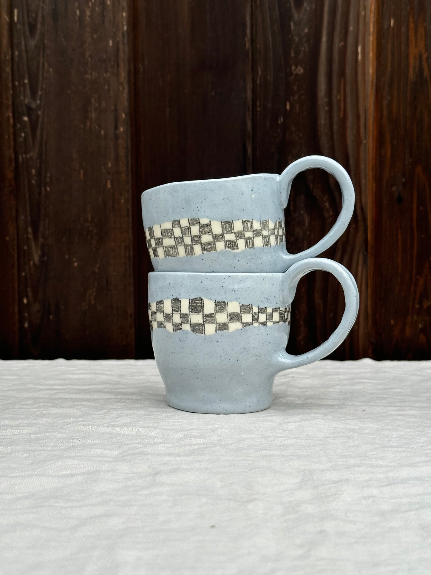 blue clay mug with pencil check