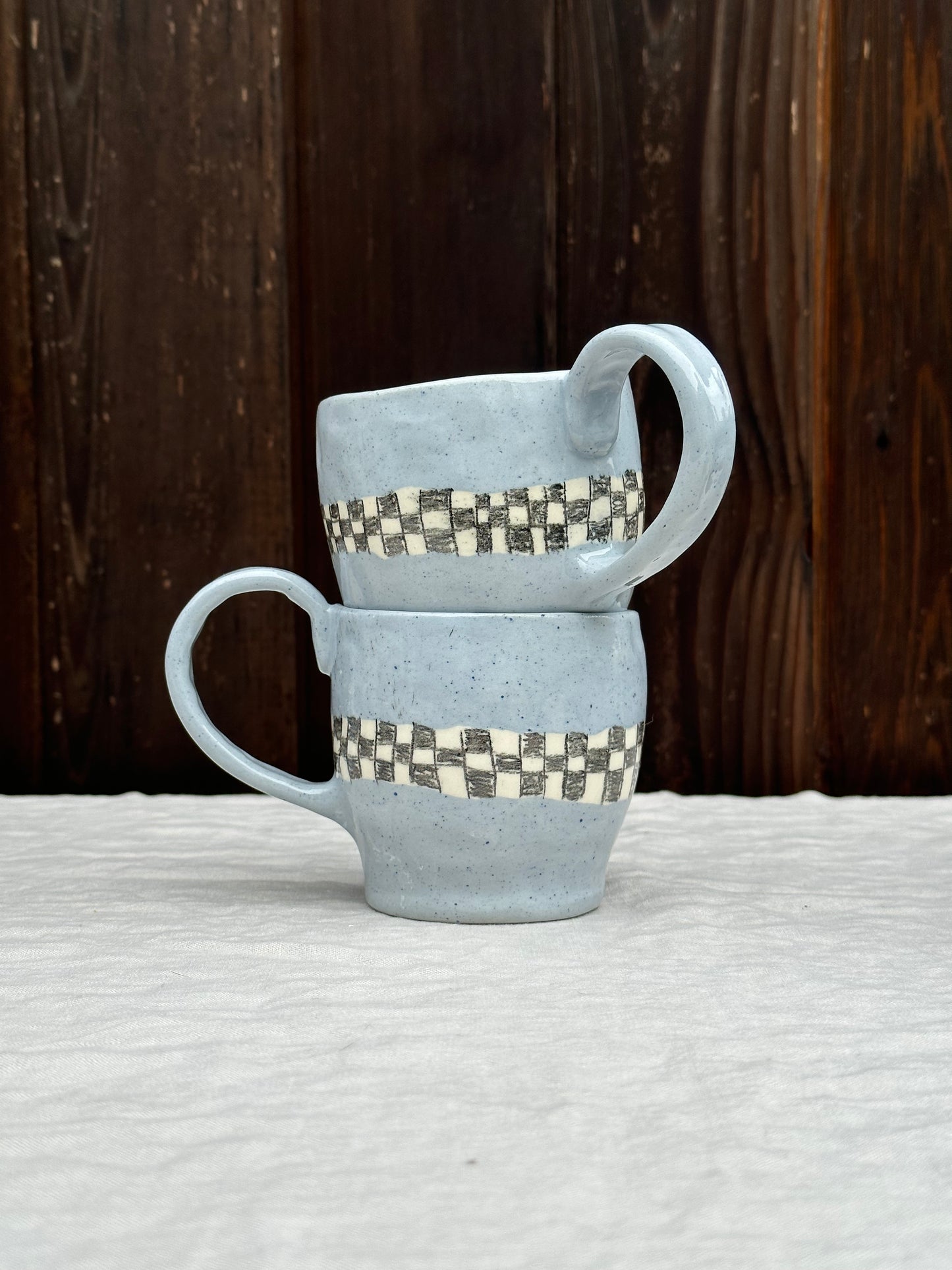 blue clay mug with pencil check