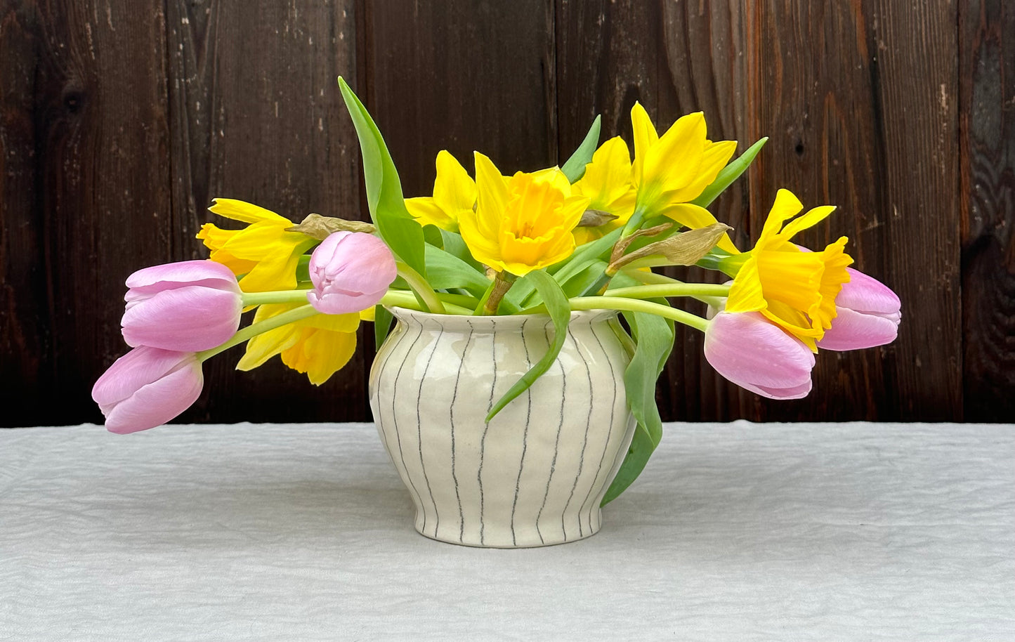 white low vase with rim and pencil stripe